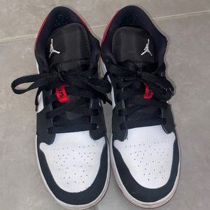 Red and black Nike low dunks